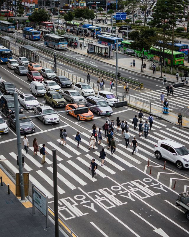 Crowded Seoul crosswalk seen from above