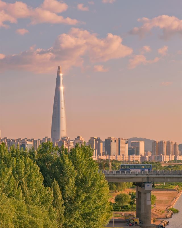 Lotte World Tower above the Han River at sunset