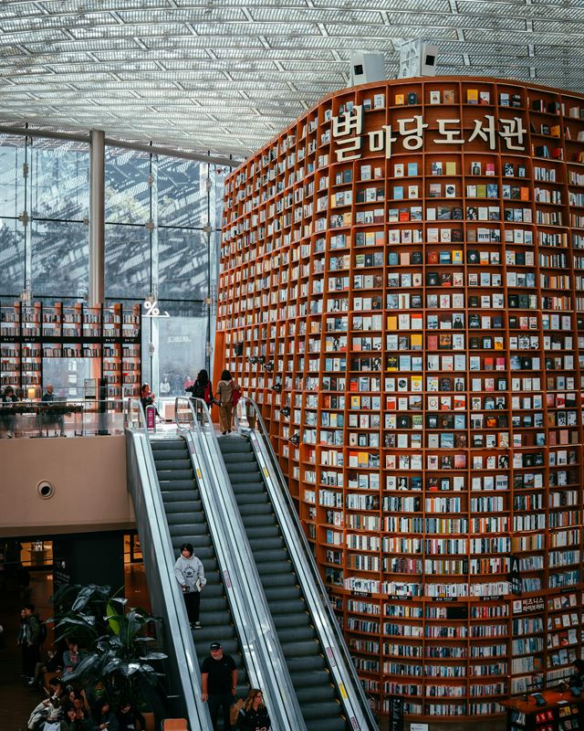 Towering curved bookshelves of Starfield Library in Seoul