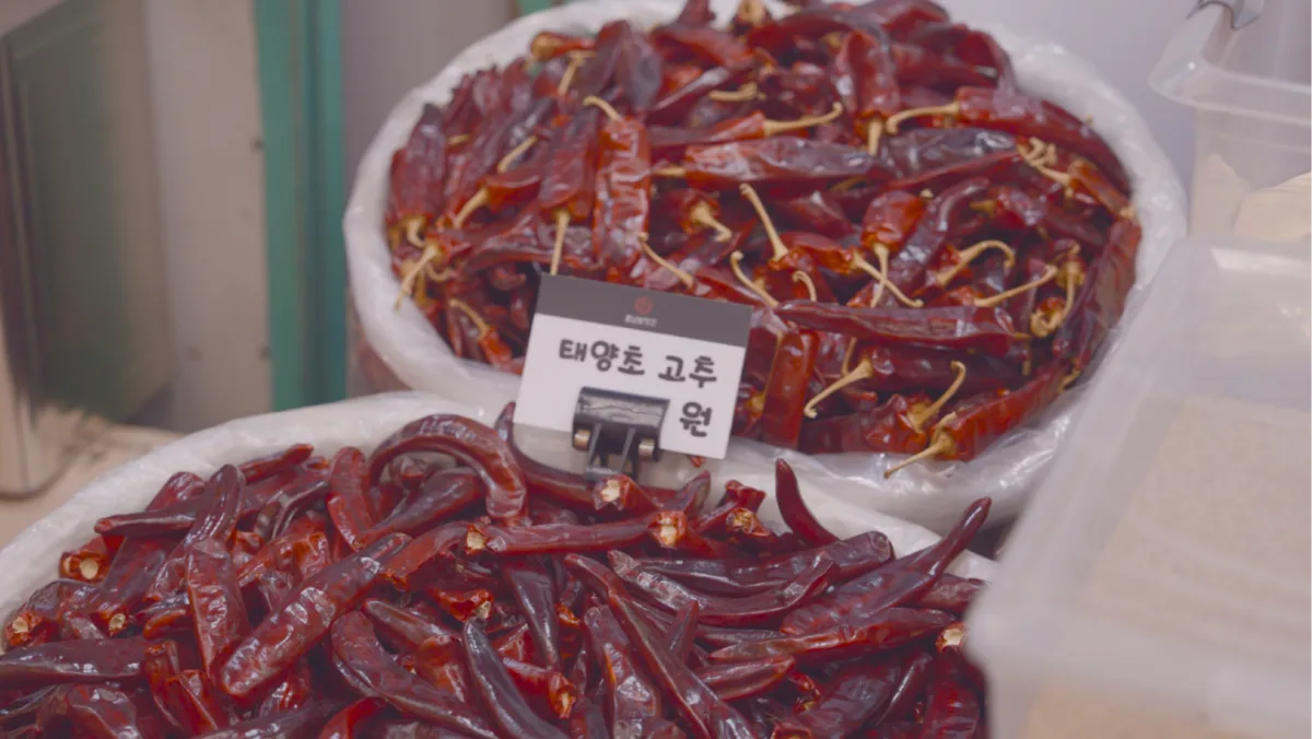 Baskets of dried Korean red peppers at a market