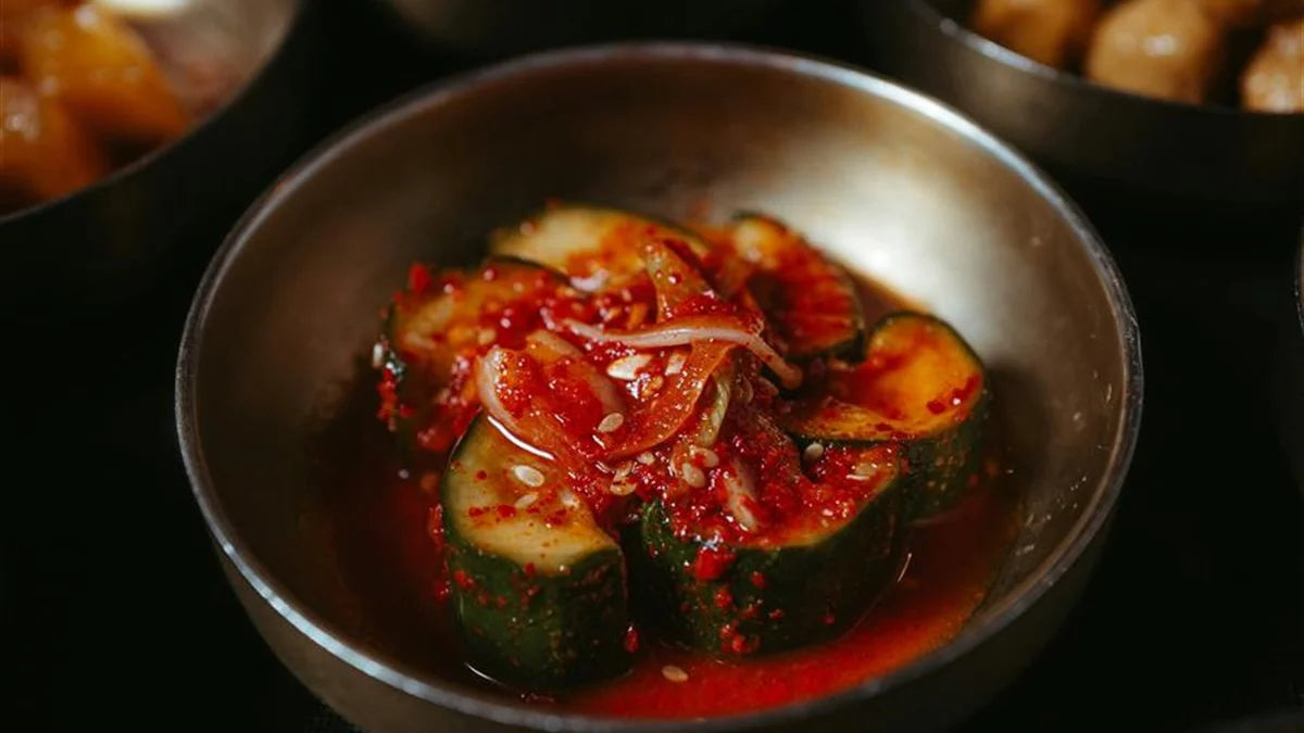 Korean spicy cucumber salad oi muchim in a bowl with sesame seeds